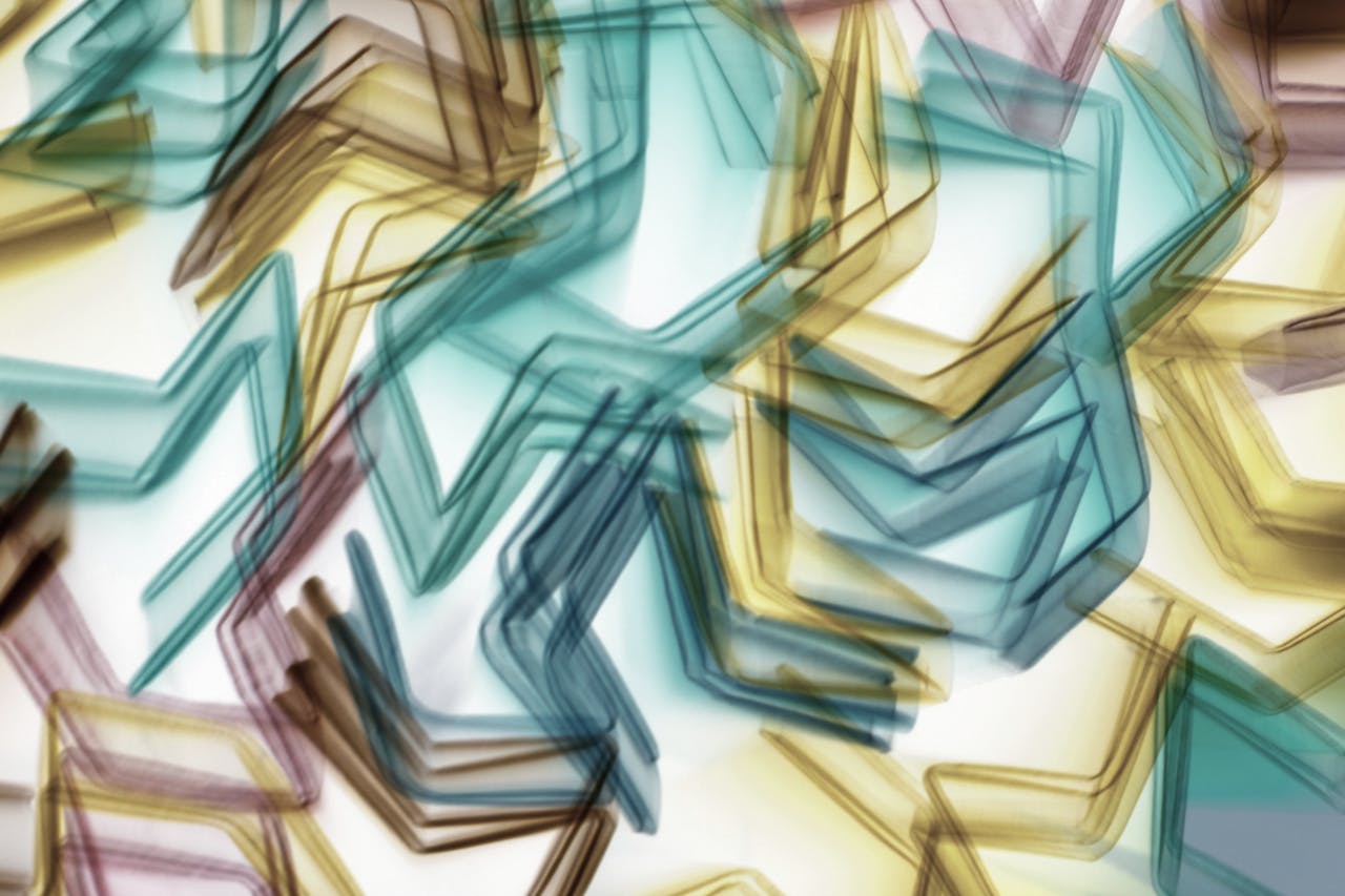 Dynamic abstract pattern with colorful geometric shapes creating a vibrant light play.